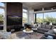 Inviting living room featuring stylish decor, comfortable seating, and large windows for natural light at 26885 N 104Th Pl, Scottsdale, AZ 85262