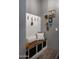 Mud room featuring built-in bench with storage and decor creating an organized and welcoming transition space at 26885 N 104Th Pl, Scottsdale, AZ 85262