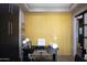 An office featuring modern furnishings with a minimalist design and bright yellow wall at 26885 N 104Th Pl, Scottsdale, AZ 85262