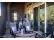 Relaxing outdoor patio features comfortable seating, mountain views, and a stylish bar area for elevated entertaining at 26885 N 104Th Pl, Scottsdale, AZ 85262