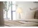 Close-up of a plush bedroom setting with soft pillows, a cozy blanket, and natural light from a nearby window at 312 E Windsor Ave # 6, Phoenix, AZ 85004