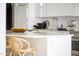 Close-up of the kitchen island, featuring modern design and bar stool seating at 312 E Windsor Ave # 6, Phoenix, AZ 85004