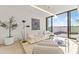 Bright living room featuring a plush sofa, modern decor, and a large sliding glass door leading to a balcony at 312 E Windsor Ave # 6, Phoenix, AZ 85004
