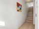 Clean, minimalist staircase design with hardwood steps and light walls, complemented by modern art at 312 E Windsor Ave # 6, Phoenix, AZ 85004