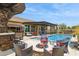 Entertainer's backyard with a pool, fire pit, outdoor seating, and spa at 33305 N 26Th Ave, Phoenix, AZ 85085