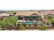 Spacious backyard featuring a pool, covered patio, dining area, outdoor furniture, and desert landscape at 33305 N 26Th Ave, Phoenix, AZ 85085