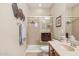 Bathroom with neutral decor, shower with glass doors and single vanity at 33305 N 26Th Ave, Phoenix, AZ 85085