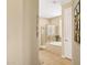 Bright bathroom showcasing a glass shower and soaking tub with tile flooring at 33305 N 26Th Ave, Phoenix, AZ 85085