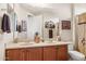 Bathroom featuring double sinks and a decorative shower curtain at 33305 N 26Th Ave, Phoenix, AZ 85085