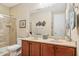 Bathroom with double vanity, walk-in shower and a frameless mirror at 33305 N 26Th Ave, Phoenix, AZ 85085