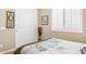 Cozy bedroom featuring plantation shutters and neutral decor at 33305 N 26Th Ave, Phoenix, AZ 85085