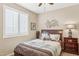 Inviting bedroom featuring a cozy bed, shuttered window, and stylish decor at 33305 N 26Th Ave, Phoenix, AZ 85085