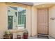 Inviting front entrance with covered porch, potted succulents, and a 'Welcome' mat at 33305 N 26Th Ave, Phoenix, AZ 85085