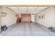 Spacious garage with ample storage cabinets and a clean epoxy floor at 33305 N 26Th Ave, Phoenix, AZ 85085