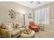Comfortable living room with plantation shutters and neutral furnishings at 33305 N 26Th Ave, Phoenix, AZ 85085