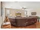 Spacious living room featuring a large brown leather sectional and hardwood floors at 33305 N 26Th Ave, Phoenix, AZ 85085