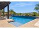 Refreshing pool with tile accents and a well-maintained surrounding landscape at 33305 N 26Th Ave, Phoenix, AZ 85085