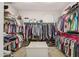 Walk-in closet with organized storage solutions including clothing racks and shelving at 33305 N 26Th Ave, Phoenix, AZ 85085