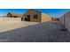 View of the backyard showing fence and gravel ground covering at 3704 E Haflinger Rd, San Tan Valley, AZ 85140