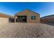View of the backyard showing gravel and covered patio at 3704 E Haflinger Rd, San Tan Valley, AZ 85140