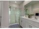 Bathroom with double vanity, framed mirrors, and a glass-enclosed shower at 3704 E Haflinger Rd, San Tan Valley, AZ 85140
