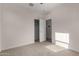 Neutral bedroom with carpet, closet and attached bathroom at 3704 E Haflinger Rd, San Tan Valley, AZ 85140
