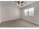 Bright bedroom featuring a window, neutral carpet, and ample natural light at 3704 E Haflinger Rd, San Tan Valley, AZ 85140