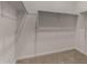 Walk-in closet with carpet and metal hanging racks for clothes storage at 3704 E Haflinger Rd, San Tan Valley, AZ 85140