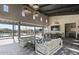 Community recreation room with comfortable lounge seating, kitchen area, and outdoor pool views at 3704 E Haflinger Rd, San Tan Valley, AZ 85140