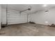 Spacious two-car garage with concrete floor and white walls at 3704 E Haflinger Rd, San Tan Valley, AZ 85140