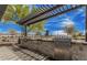Community outdoor grilling area with stainless steel grills, stone countertops, and stainless steel cabinets at 3704 E Haflinger Rd, San Tan Valley, AZ 85140