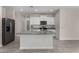 Bright kitchen features a large island, granite countertops, and stainless steel appliances at 3704 E Haflinger Rd, San Tan Valley, AZ 85140