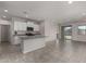 Living room next to kitchen features an island, stainless steel appliances and recessed lighting at 3704 E Haflinger Rd, San Tan Valley, AZ 85140