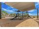 Community playground featuring covered slides, climbing structures, and wood chip ground covering at 3704 E Haflinger Rd, San Tan Valley, AZ 85140