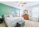 Bright bedroom with a queen bed, neutral carpeting, ceiling fan and a dresser with a mirror at 3947 W Maggie Dr, San Tan Valley, AZ 85144