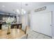 Open floorplan with dining area adjacent to kitchen, featuring tile floors and neutral decor at 3947 W Maggie Dr, San Tan Valley, AZ 85144