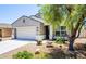 Charming single-story home with a well-manicured front yard, featuring desert landscaping and a welcoming entrance at 3947 W Maggie Dr, San Tan Valley, AZ 85144