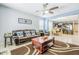 Spacious living room with comfortable seating, neutral paint, and views of the adjacent kitchen and dining area at 3947 W Maggie Dr, San Tan Valley, AZ 85144