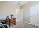 Bright office space with a traditional wooden desk and great lighting for enhanced concentration and focus at 3947 W Maggie Dr, San Tan Valley, AZ 85144