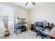 Bright home office with a traditional wooden desk, ample storage, and a window for natural light, creating a productive workspace at 3947 W Maggie Dr, San Tan Valley, AZ 85144