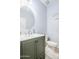 Stylish powder room with a modern vanity, decorative mirror, and neutral wall color at 3947 W Maggie Dr, San Tan Valley, AZ 85144