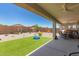 Covered patio and landscaped backyard at 40141 W James Ln, Maricopa, AZ 85138