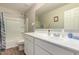Bathroom featuring a large vanity with bright, neutral light and tub/shower combo at 40141 W James Ln, Maricopa, AZ 85138