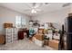 A bedroom filled with a window, a desk, and boxes to be used for storage at 40141 W James Ln, Maricopa, AZ 85138