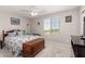 Bright bedroom features a window with views and comfortable furnishings at 40141 W James Ln, Maricopa, AZ 85138