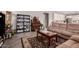 Open-concept living room with tile floors, comfortable couches, and stylish decor at 40141 W James Ln, Maricopa, AZ 85138