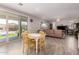 Open floorplan with a dining area and living room connected to an outdoor patio at 40141 W James Ln, Maricopa, AZ 85138