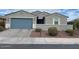 Charming single-story home with a well-maintained front yard and a two-car garage at 4040 E Caitlin Dr, San Tan Valley, AZ 85140