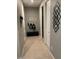 Hallway with tiled flooring, coat racks and decor at 4040 E Caitlin Dr, San Tan Valley, AZ 85140