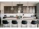 An open kitchen featuring granite countertops, stainless appliances, and modern pendant lighting at 4040 E Caitlin Dr, San Tan Valley, AZ 85140